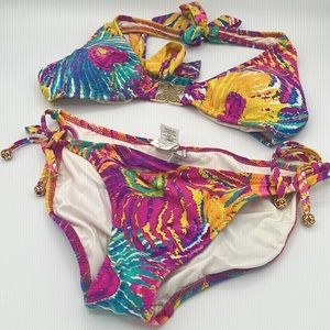 Trina Turke multicolored sexy bikini with gold grommets. Back and neck tie.